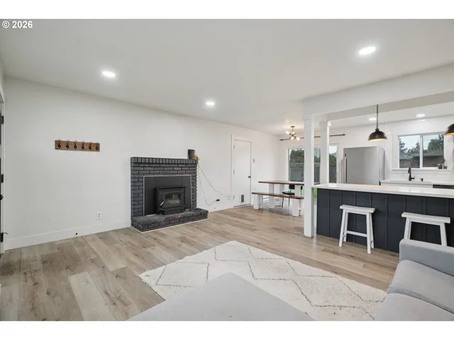 a view of kitchen with furniture and fireplace