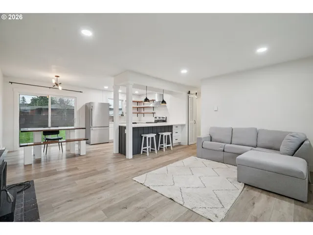 a living room with furniture and a table