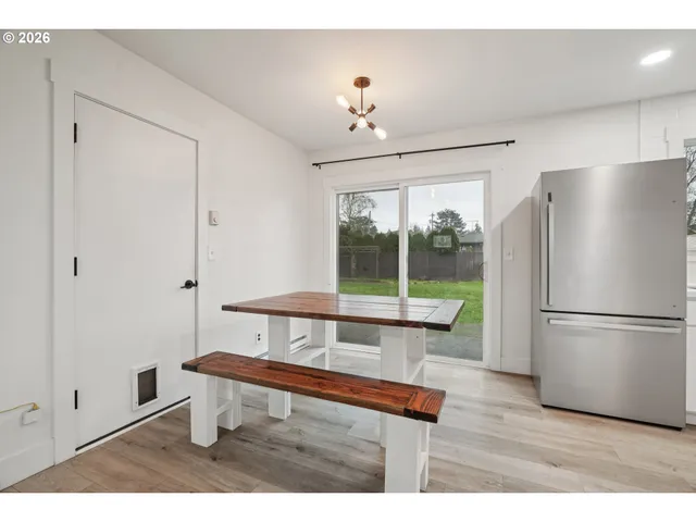 a living room with furniture a table and a chandelier