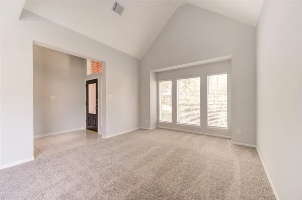 a view of an empty room with a window