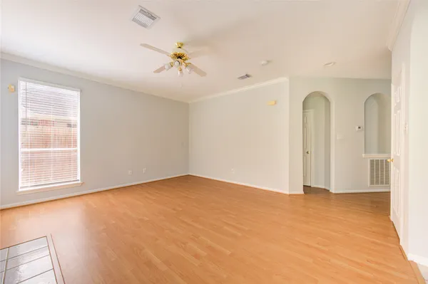 a view of an empty room with a window
