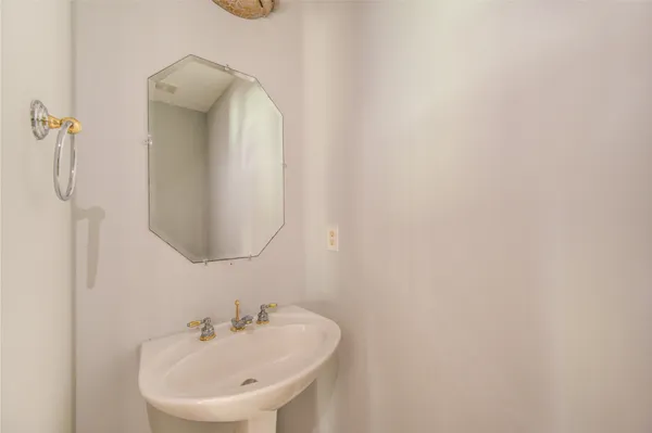 a bathroom with a sink and mirror