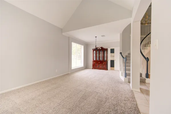 a view of a room with gym equipment and a window