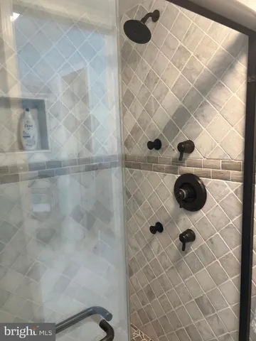 a view of front door and wooden bench