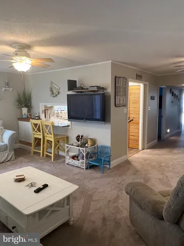 a bedroom with furniture and a flat screen tv
