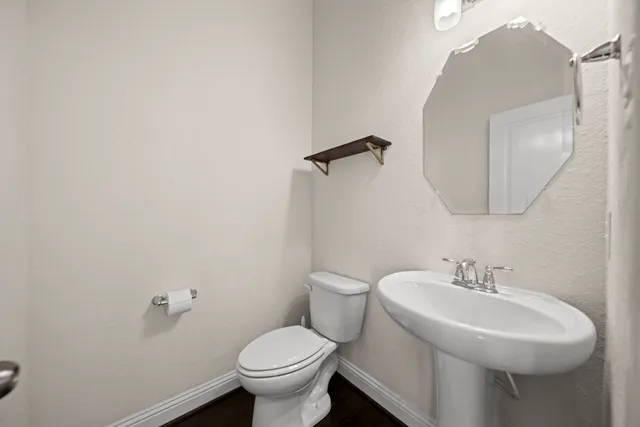 a bathroom with a sink and mirror