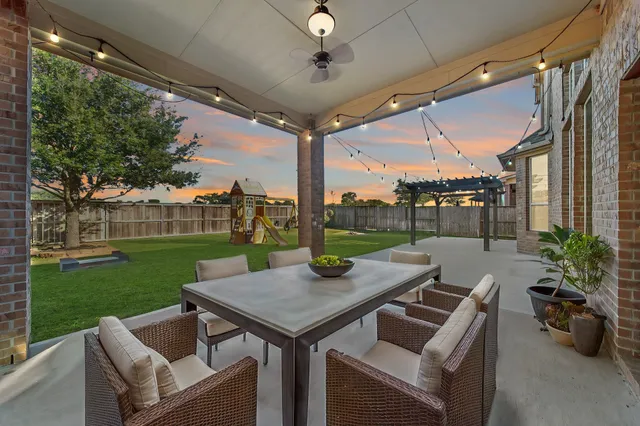 a house that has a big yard in front of it