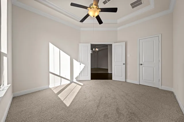 a view of entryway and hall with a ceiling fan