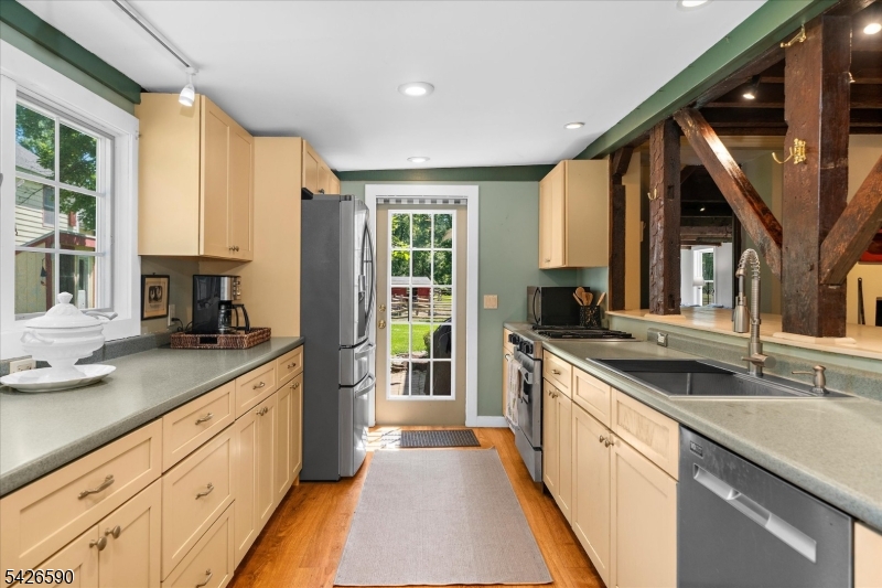 179 Lindbergh Road Hopewell, NJ 08525 - Photo 16 of 46 a kitchen with a sink stove and cabinets