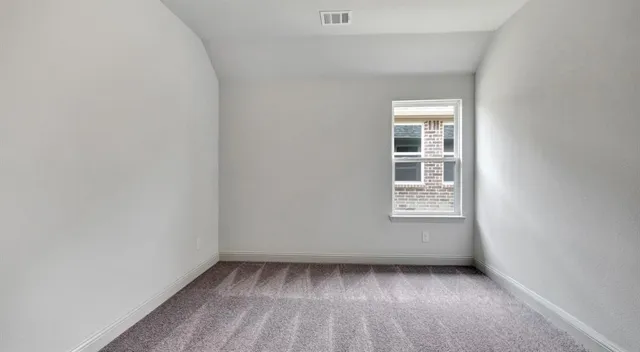 a view of a room that has a window in it