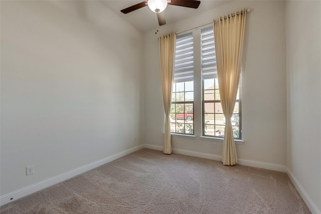 16476 Ryder Rock Road Frisco, TX 75033 - Photo 6 of 40 First floor front bedroom with tall ceiling and windows