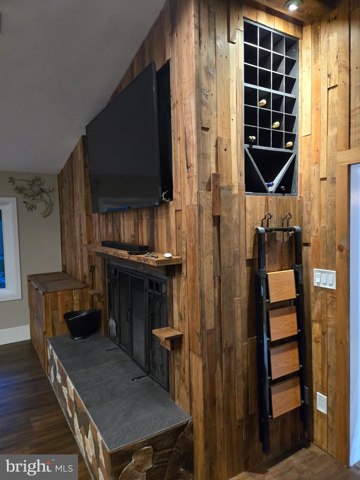 13033 Bottom Road Hydes, MD 21082 - Photo 11 of 45 a living room with furniture a flat screen tv and a fireplace