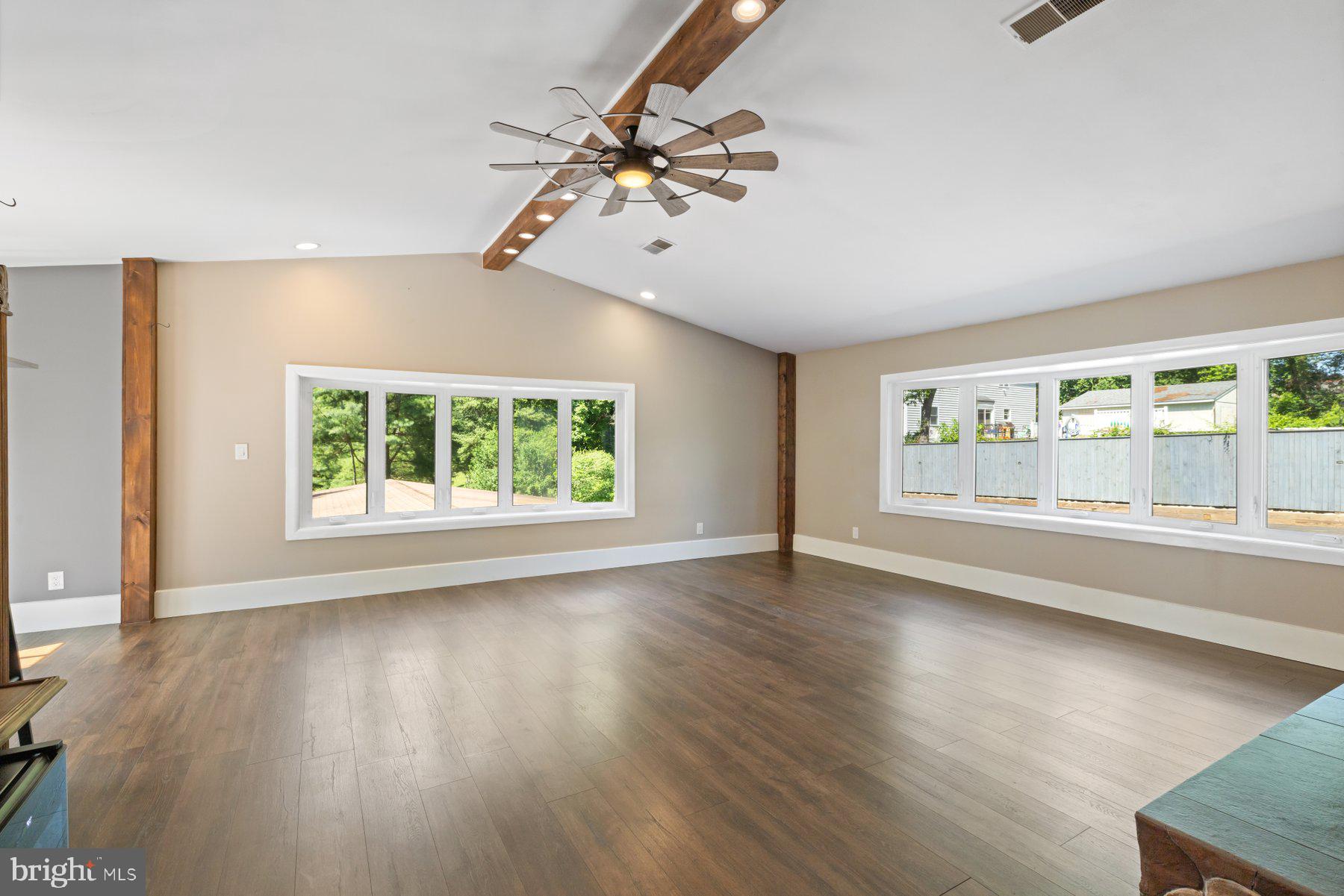 13033 Bottom Road Hydes, MD 21082 - Photo 13 of 45 a view of an empty room with wooden floor and a window