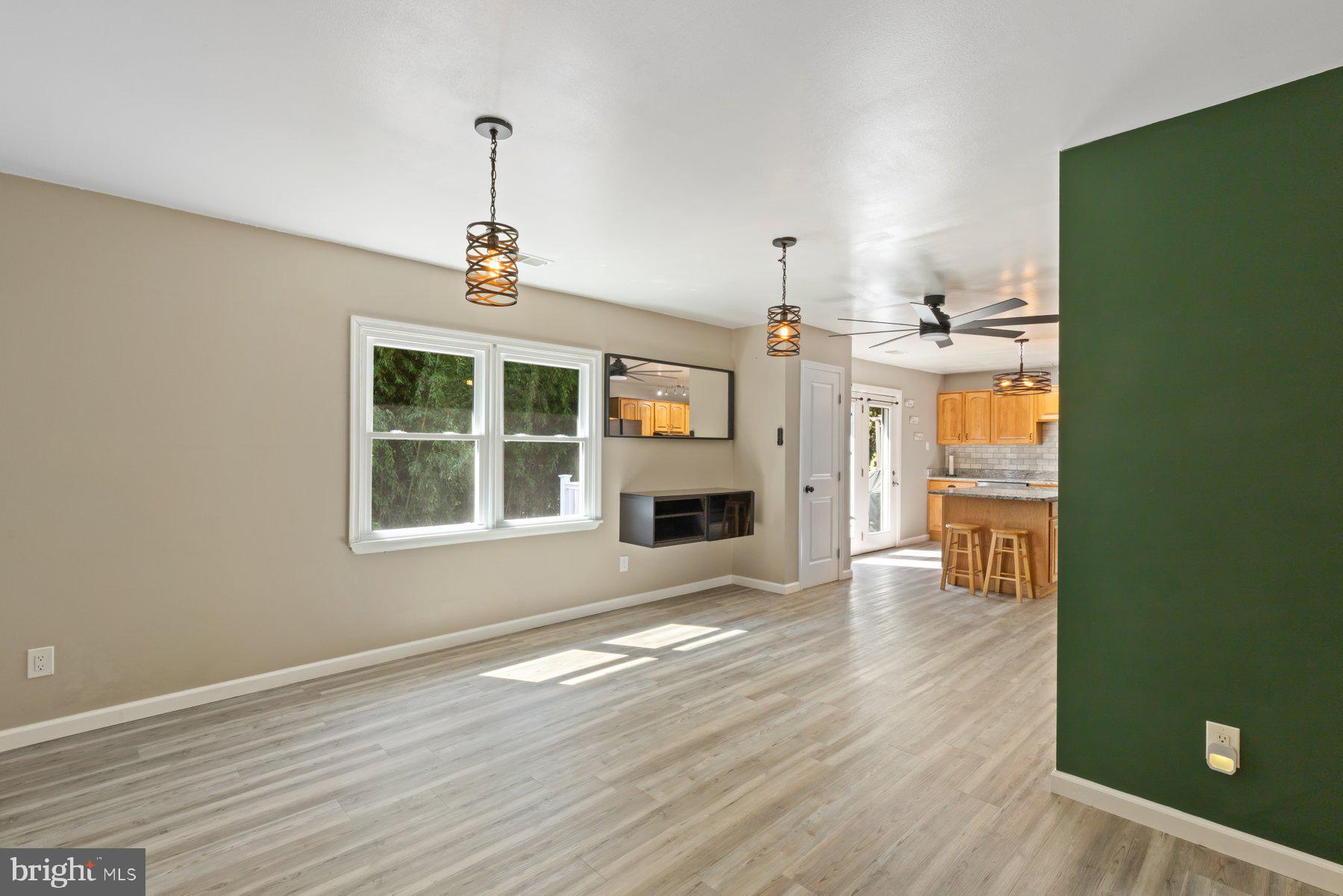 13033 Bottom Road Hydes, MD 21082 - Photo 4 of 45 wooden floor in an empty room with a window