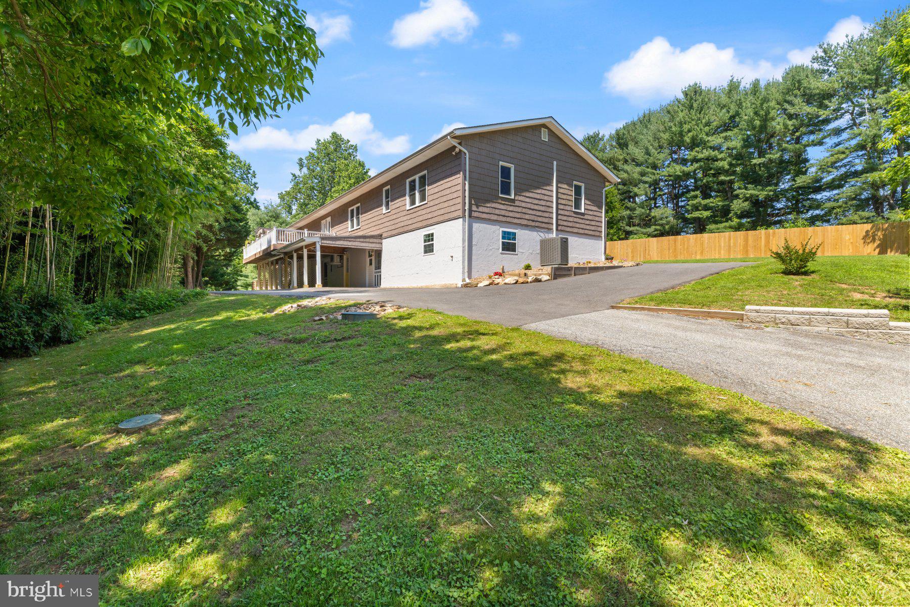 13033 Bottom Road Hydes, MD 21082 - Photo 41 of 45 a front view of a house with a yard