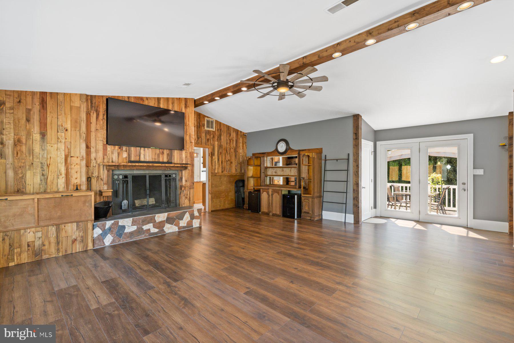13033 Bottom Road Hydes, MD 21082 - Photo 10 of 45 a view of an empty room with fire place and a fireplace