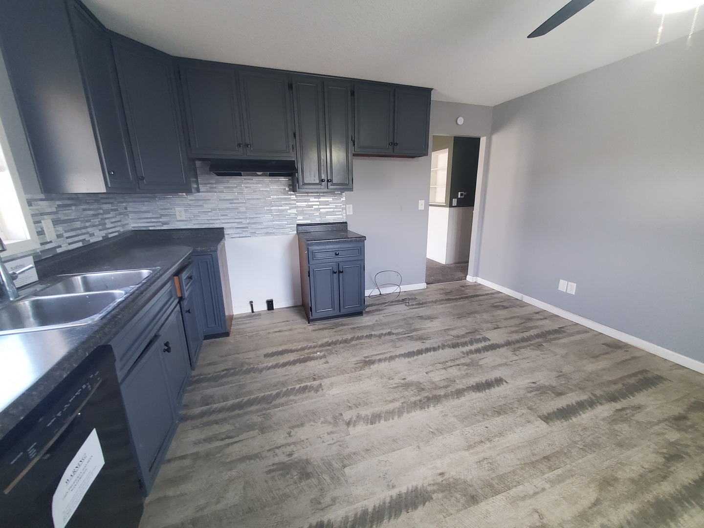 2239 13th Avenue South Clinton, IA 52732 - Photo 6 of 13 a kitchen with a sink a stove and refrigerator