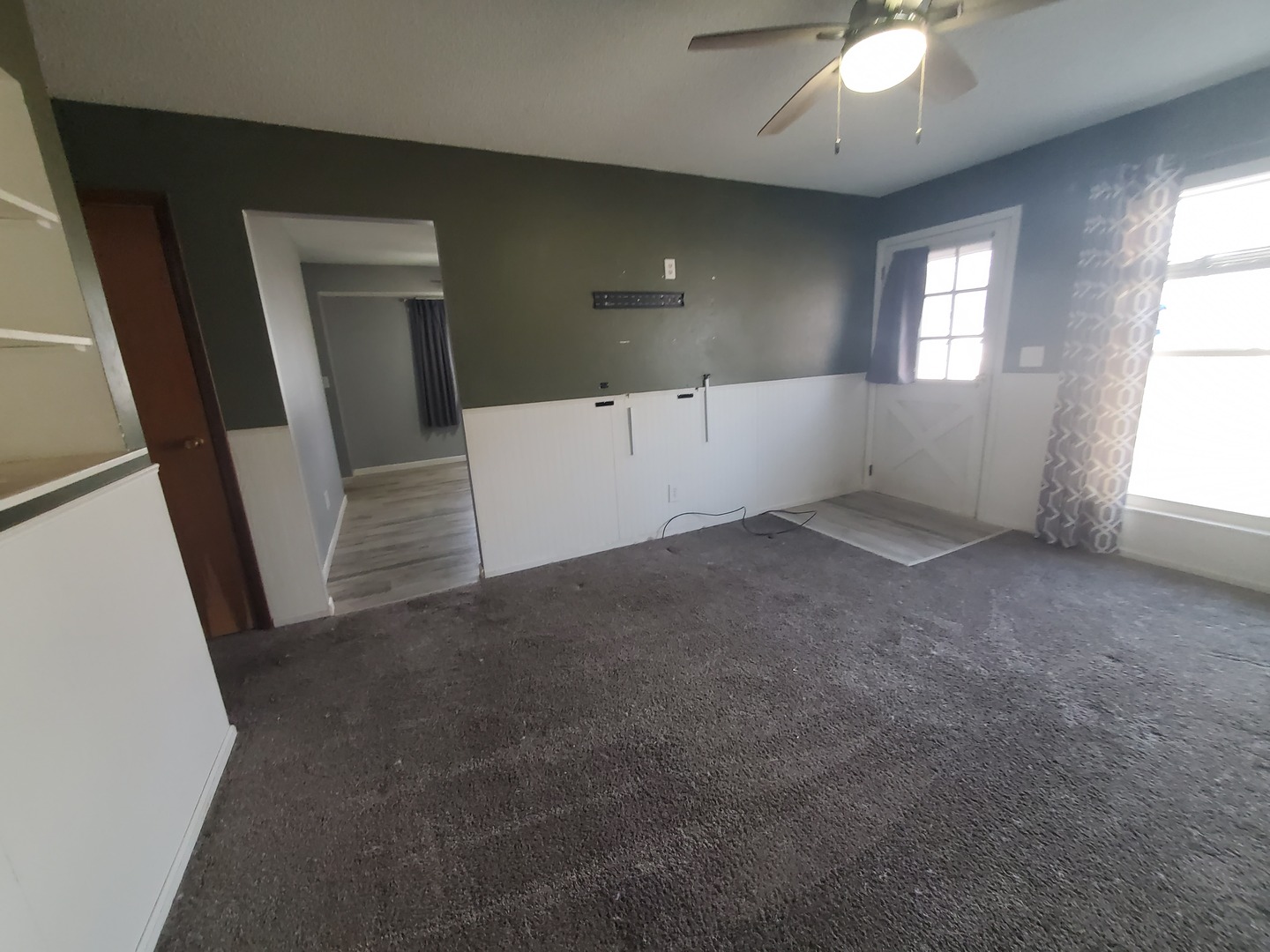 2239 13th Avenue South Clinton, IA 52732 - Photo 7 of 13 wooden floor in an empty room with a window