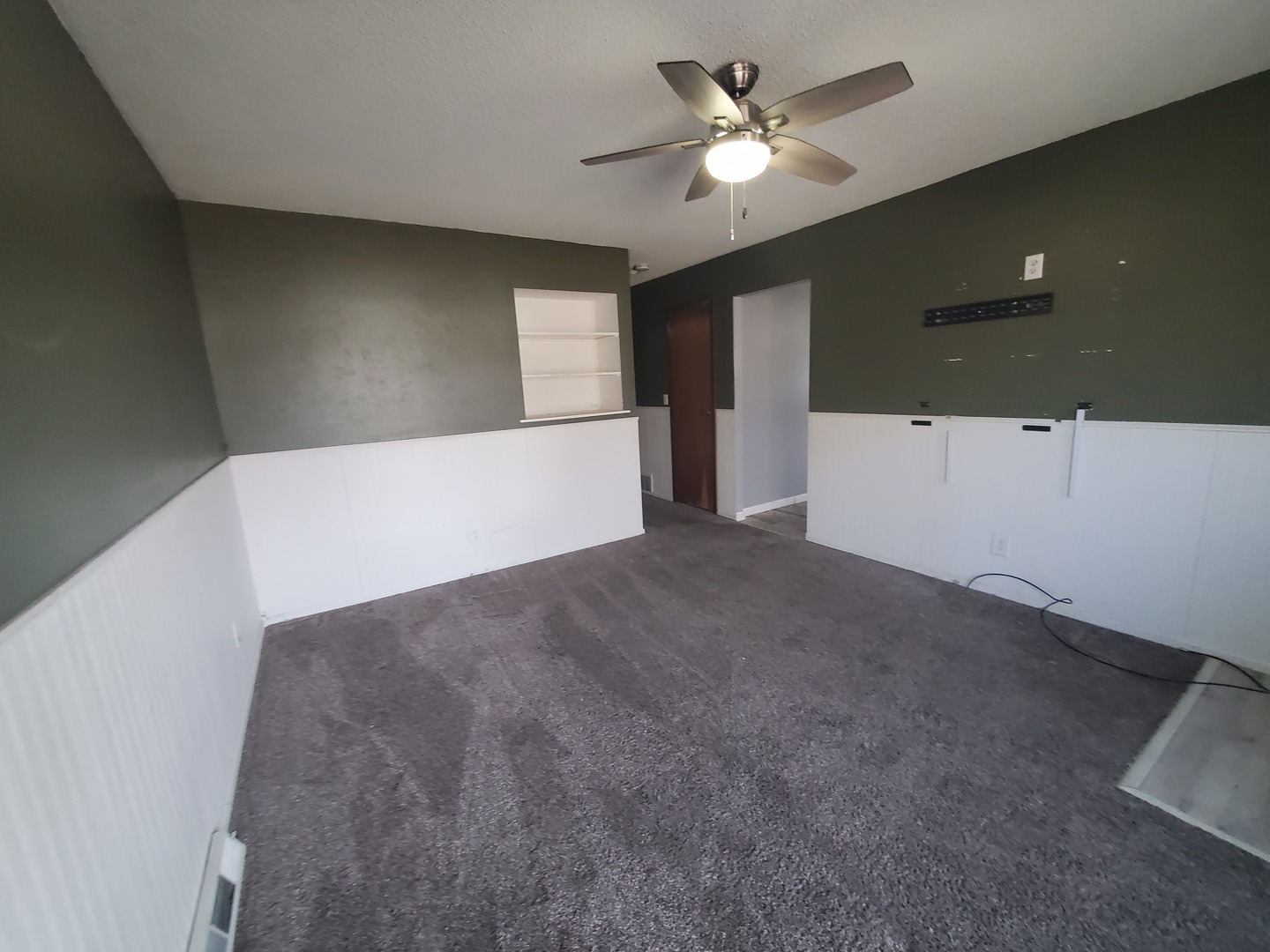 2239 13th Avenue South Clinton, IA 52732 - Photo 8 of 13 a view of a big room with ceiling fan and entryway