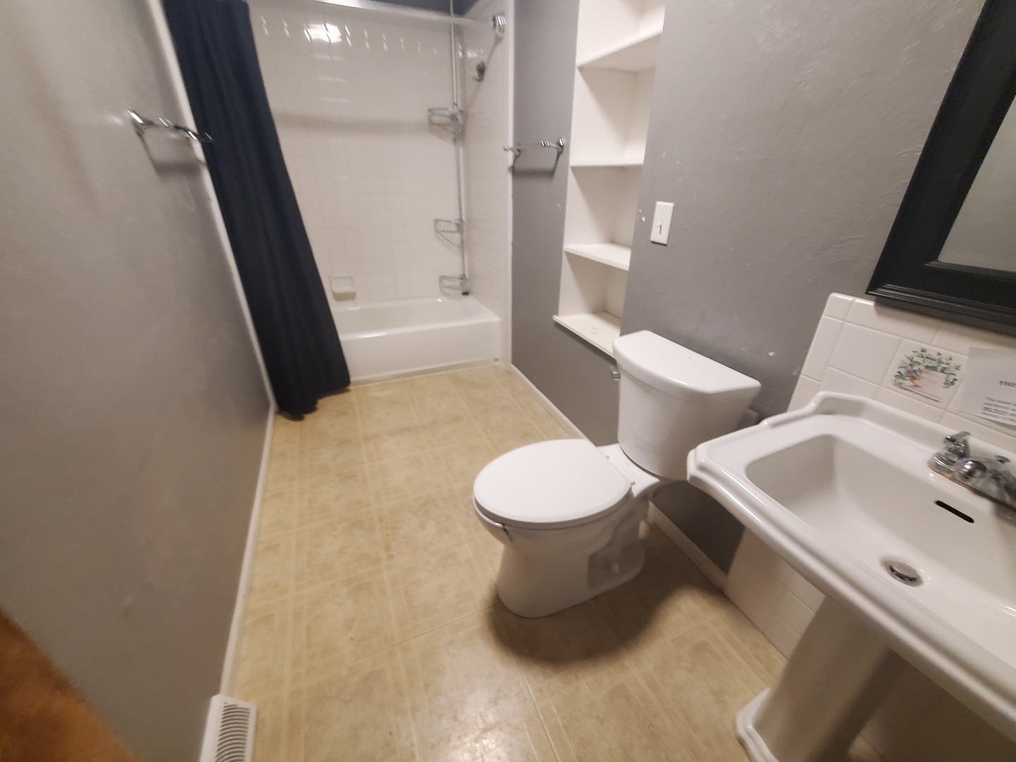 2239 13th Avenue South Clinton, IA 52732 - Photo 10 of 13 a bathroom with a sink and toilet