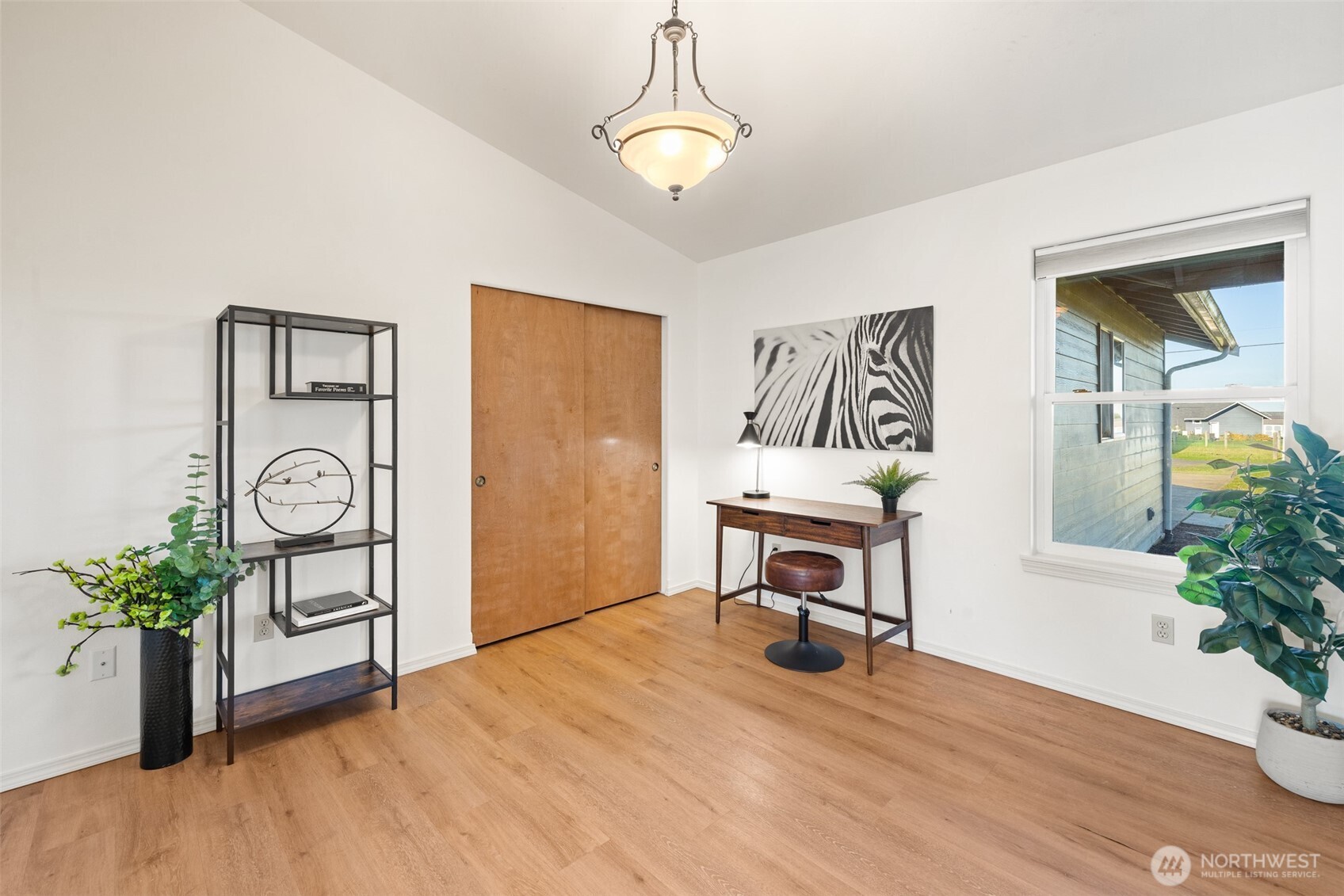 2042 Finn Hall Road Port Angeles, WA 98362 - Photo 17 of 40 a view of a workspace with furniture and a potted plant