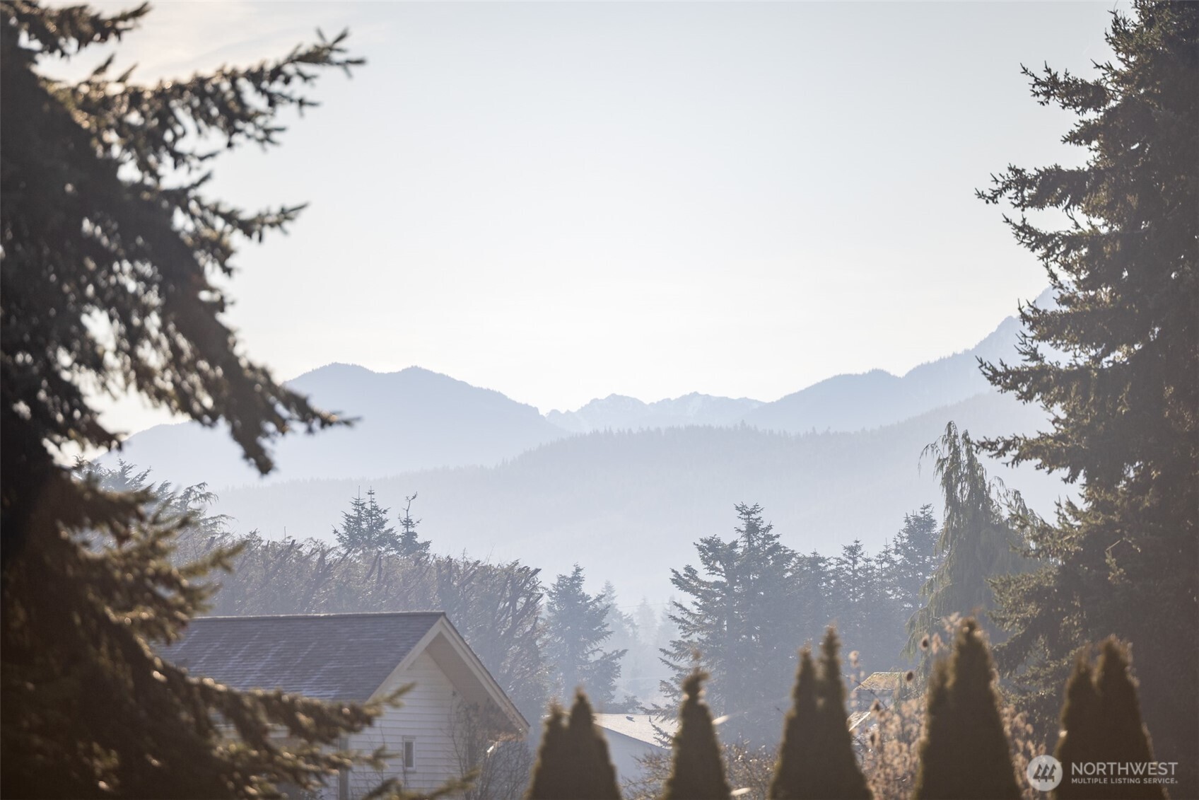 2042 Finn Hall Road Port Angeles, WA 98362 - Photo 2 of 40 a view of a city with mountains in the background