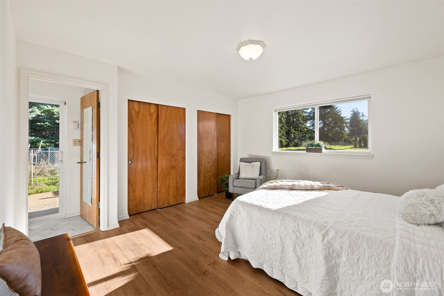 2042 Finn Hall Road Port Angeles, WA 98362 - Photo 23 of 40 a bedroom with a large bed and a window
