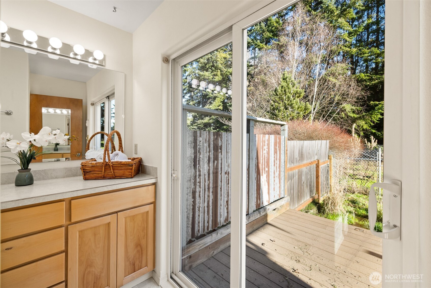 2042 Finn Hall Road Port Angeles, WA 98362 - Photo 24 of 40 a bathroom with a granite countertop sink and a mirror