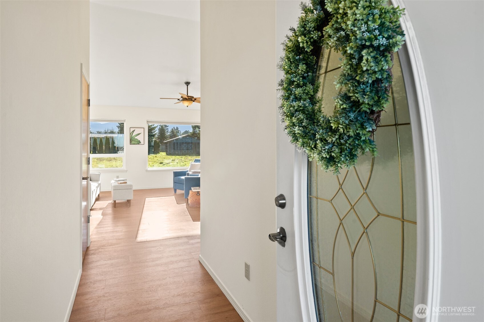 2042 Finn Hall Road Port Angeles, WA 98362 - Photo 9 of 40 a view of a hallway with wooden floor and a potted plant