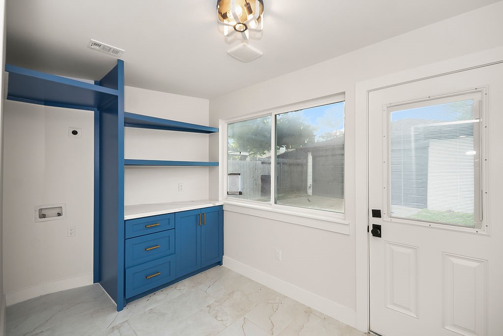 6106 Rutherglenn Drive Houston, TX 77096 - Photo 37 of 41 Flexible bonus room with built-in shelving and abundant natural light, perfect for a home office or study area.