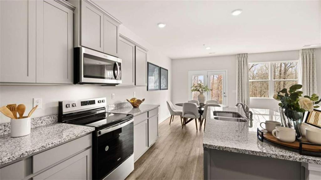 281 Sound Circle Stockbridge, GA 30281 - Photo 14 of 59 a kitchen with granite countertop lots of counter top space