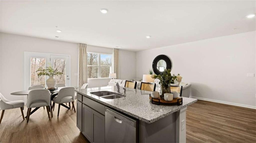 281 Sound Circle Stockbridge, GA 30281 - Photo 15 of 59 a kitchen with a table and chairs in it