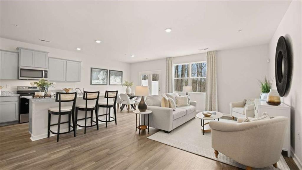 281 Sound Circle Stockbridge, GA 30281 - Photo 22 of 59 a living room with furniture and a flat screen tv