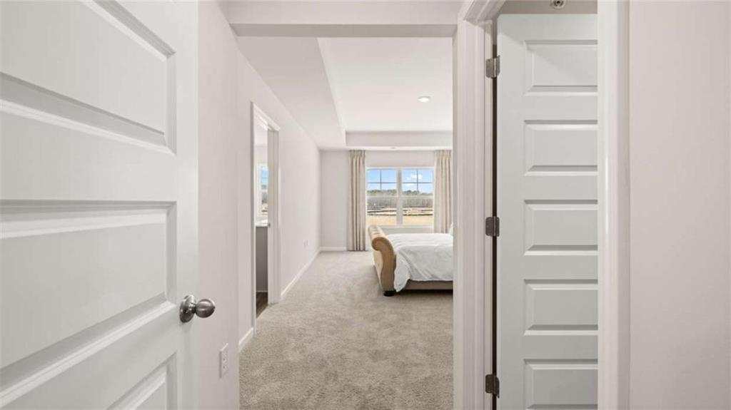 281 Sound Circle Stockbridge, GA 30281 - Photo 32 of 59 a bed room with a bed and a view of bedroom