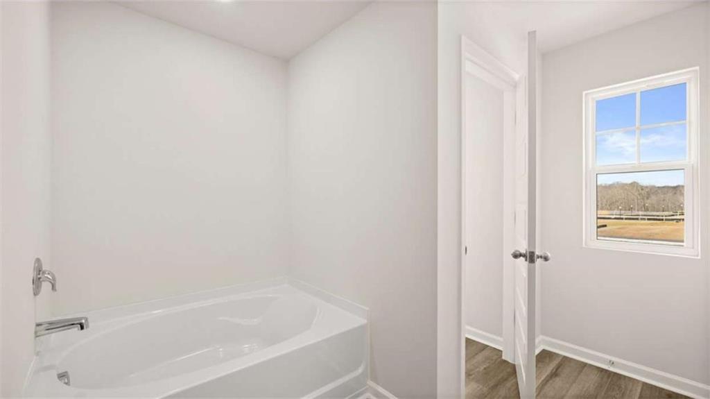 281 Sound Circle Stockbridge, GA 30281 - Photo 38 of 59 a white bath tub sitting next to a window