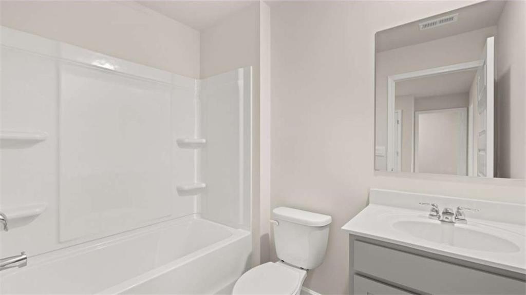 281 Sound Circle Stockbridge, GA 30281 - Photo 52 of 59 a bathroom with a sink toilet and shower