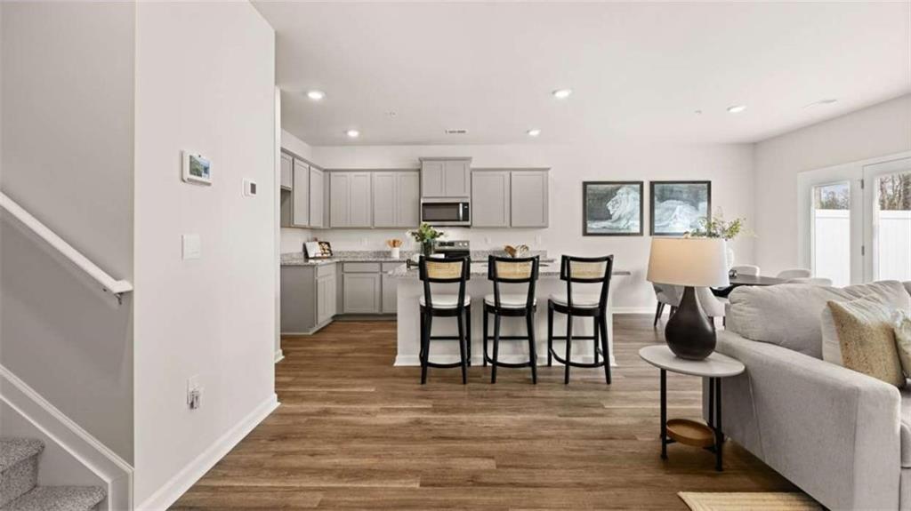 281 Sound Circle Stockbridge, GA 30281 - Photo 9 of 59 a view of kitchen with cabinets and wooden floor