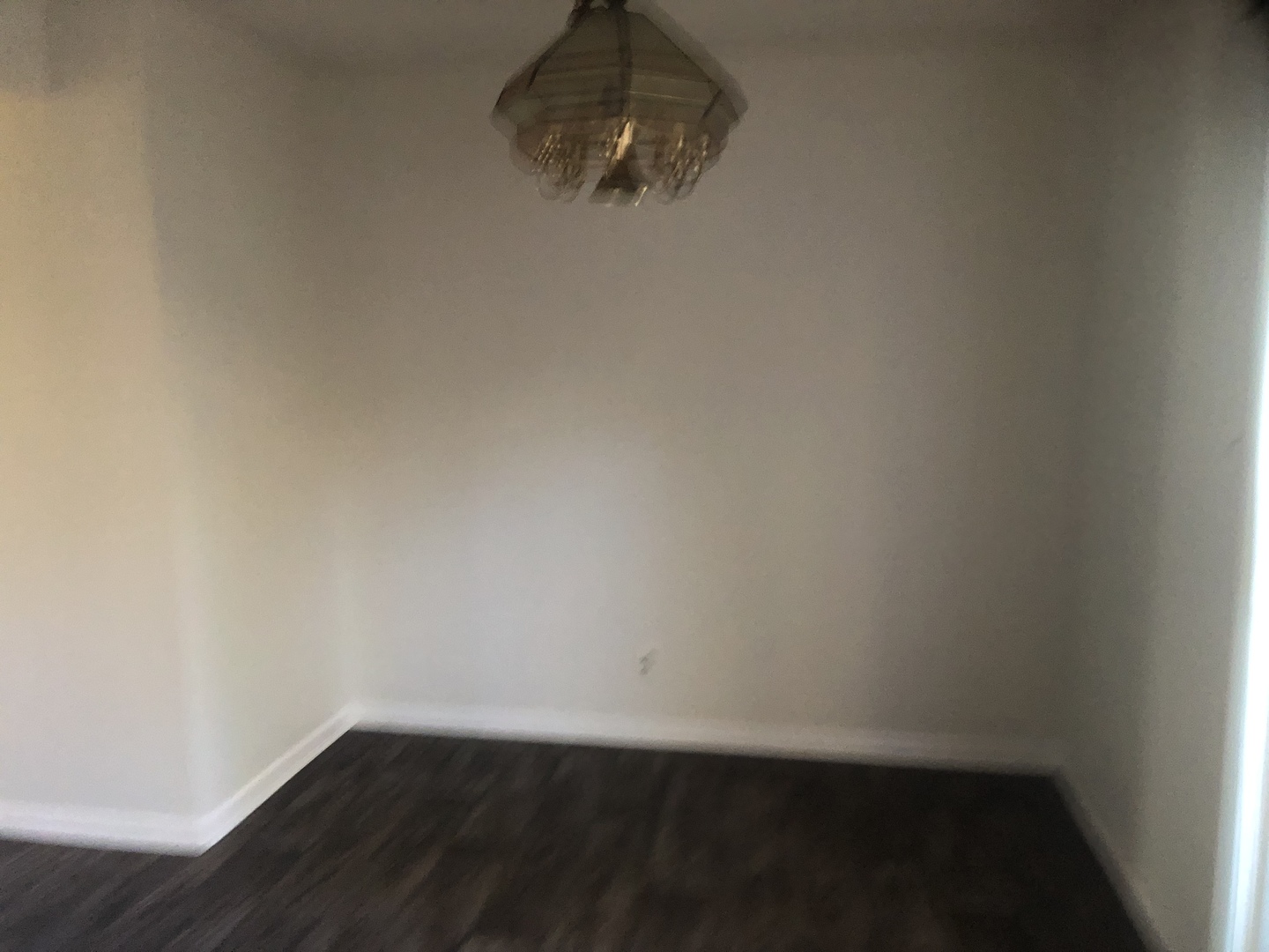 421 Providence Court Bolingbrook, IL 60440 - Photo 9 of 24 a view of an empty room with wooden floor