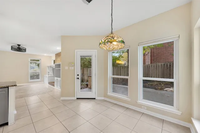 a kitchen with granite countertop a sink stainless steel appliances and cabinets
