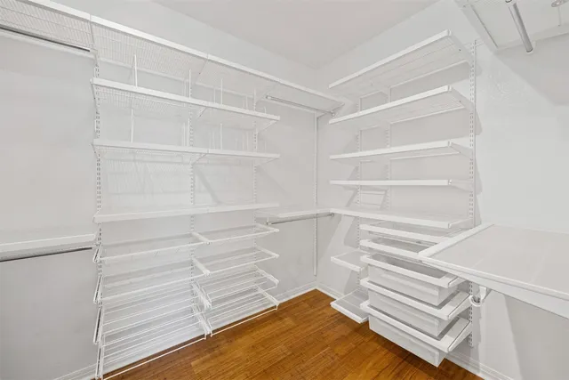a bathroom with a granite countertop toilet sink and mirror