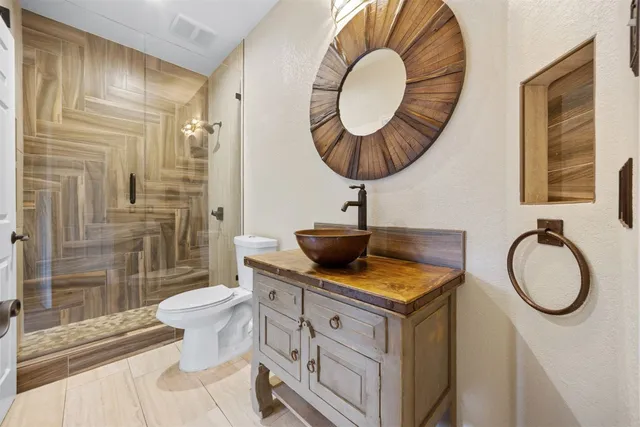 an empty room with windows and balcony