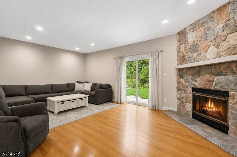 606 Park Place Springfield, NJ 07081 - Photo 5 of 21 a living room with furniture and a fireplace
