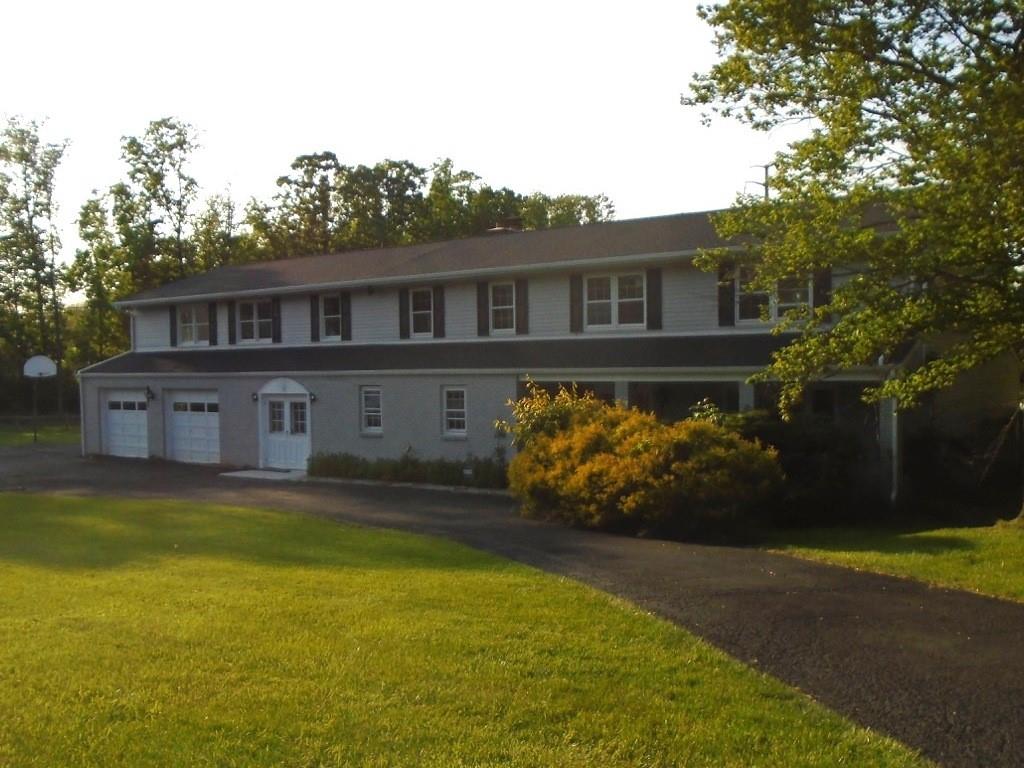 a front view of a house with swimming pool