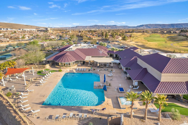 1587 Whitestone Drive St. George, UT 84790 - Photo 30 of 36 Expansive recreational complex featuring a large swimming pool, multiple lounging areas, and a spa