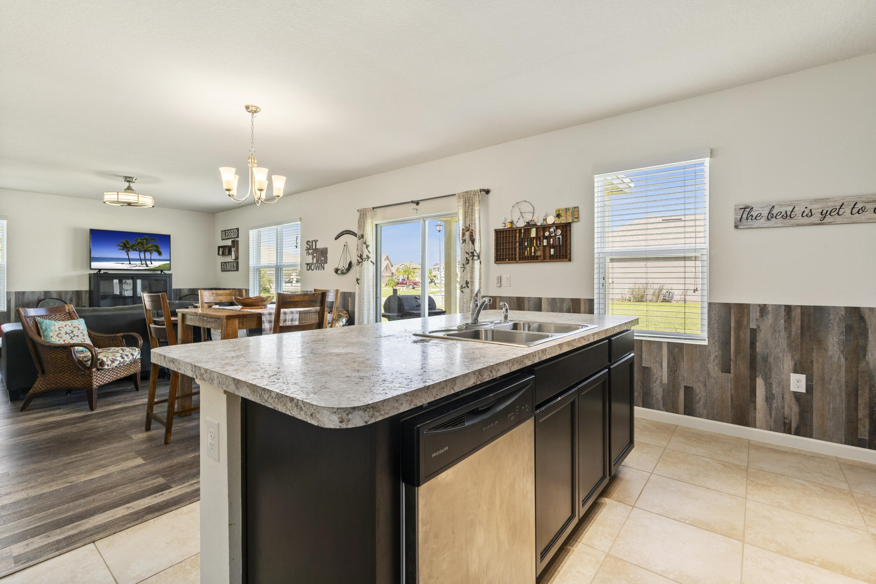 3100 Yellowstone Circle Fort Pierce, FL 34945 - Photo 13 of 28 a kitchen with counter top space sink and center island