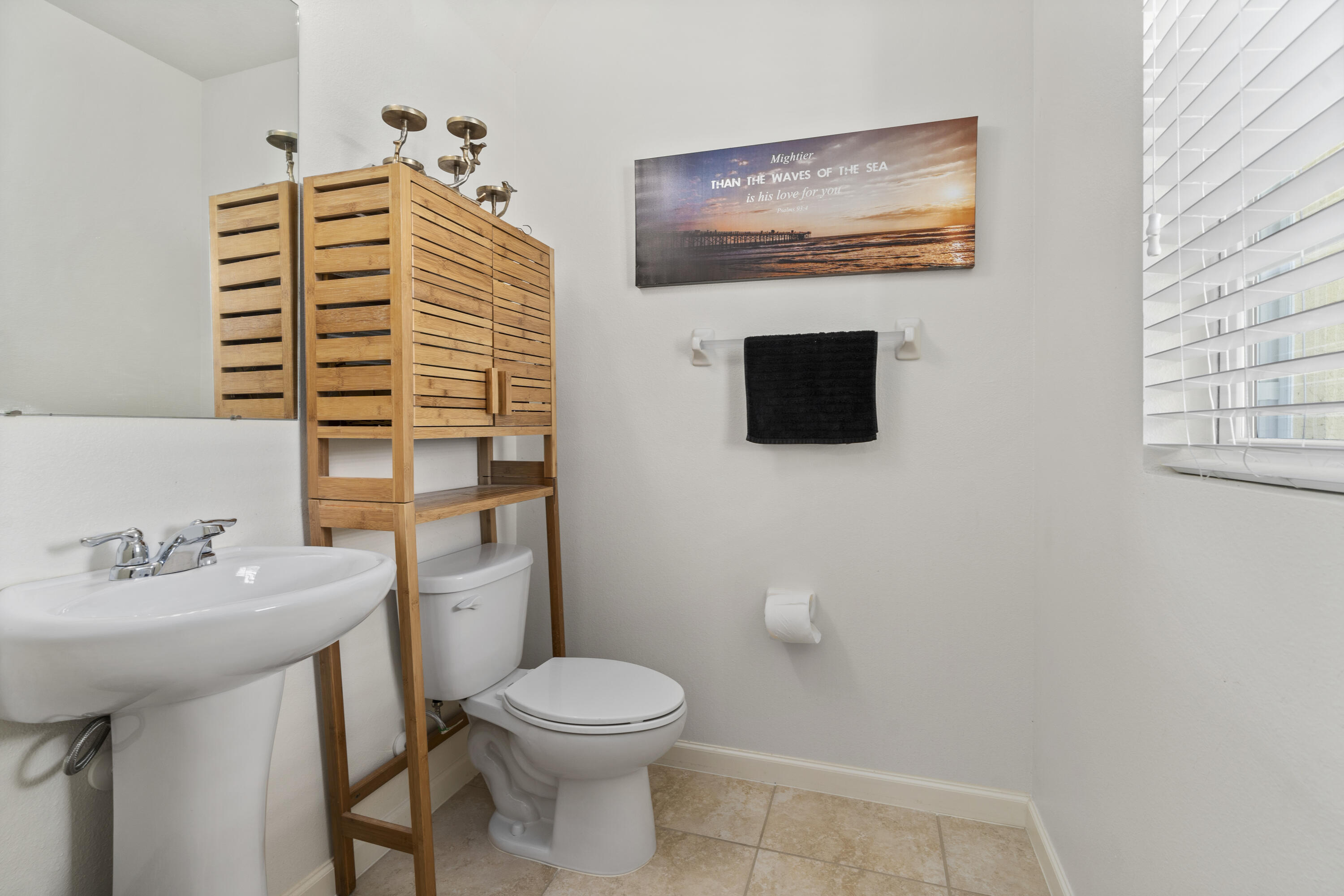 3100 Yellowstone Circle Fort Pierce, FL 34945 - Photo 15 of 28 a bathroom with a toilet a sink and mirror