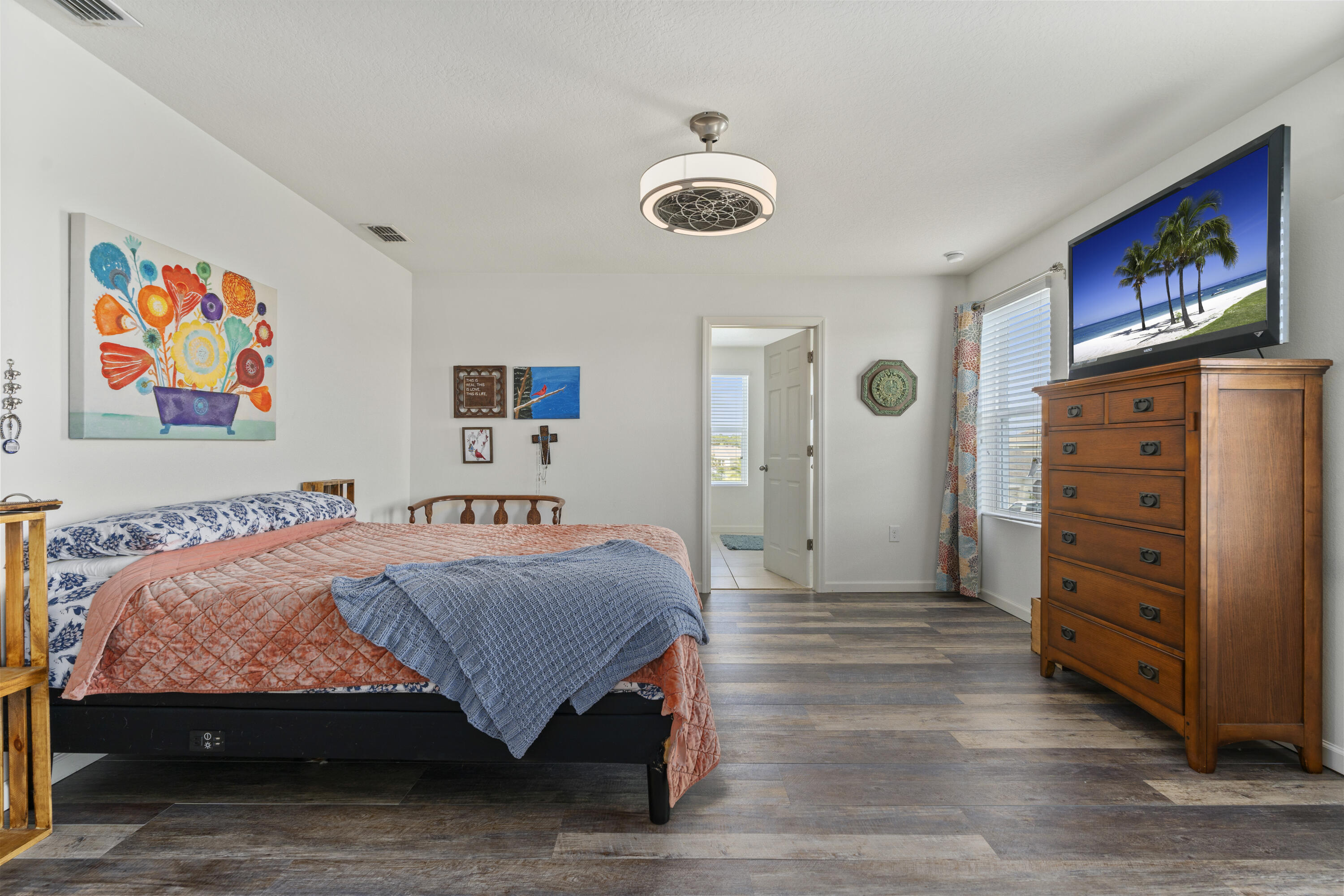 3100 Yellowstone Circle Fort Pierce, FL 34945 - Photo 17 of 28 a bedroom with a bed and dresser