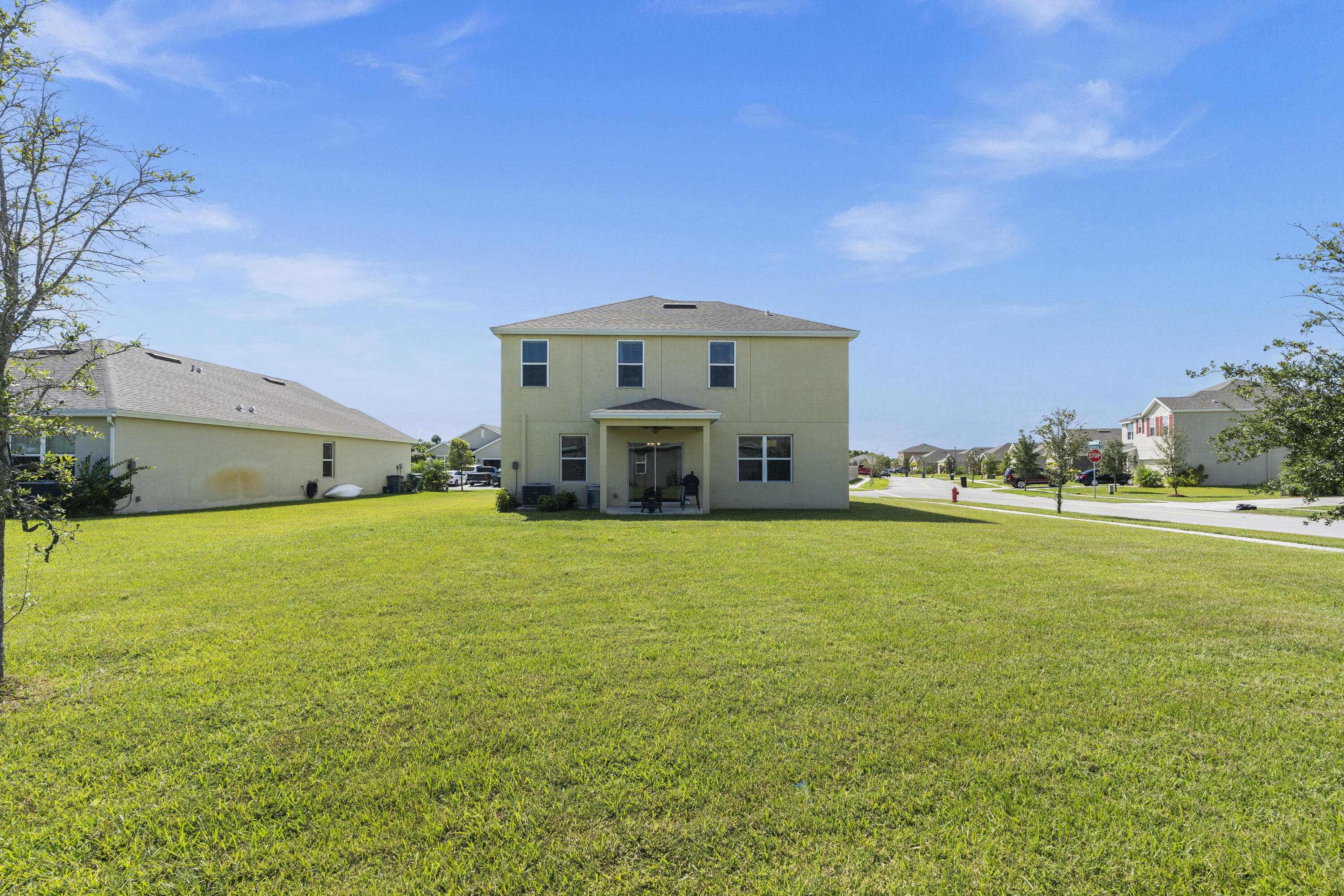 3100 Yellowstone Circle Fort Pierce, FL 34945 - Photo 26 of 28 a front view of a house with a yard