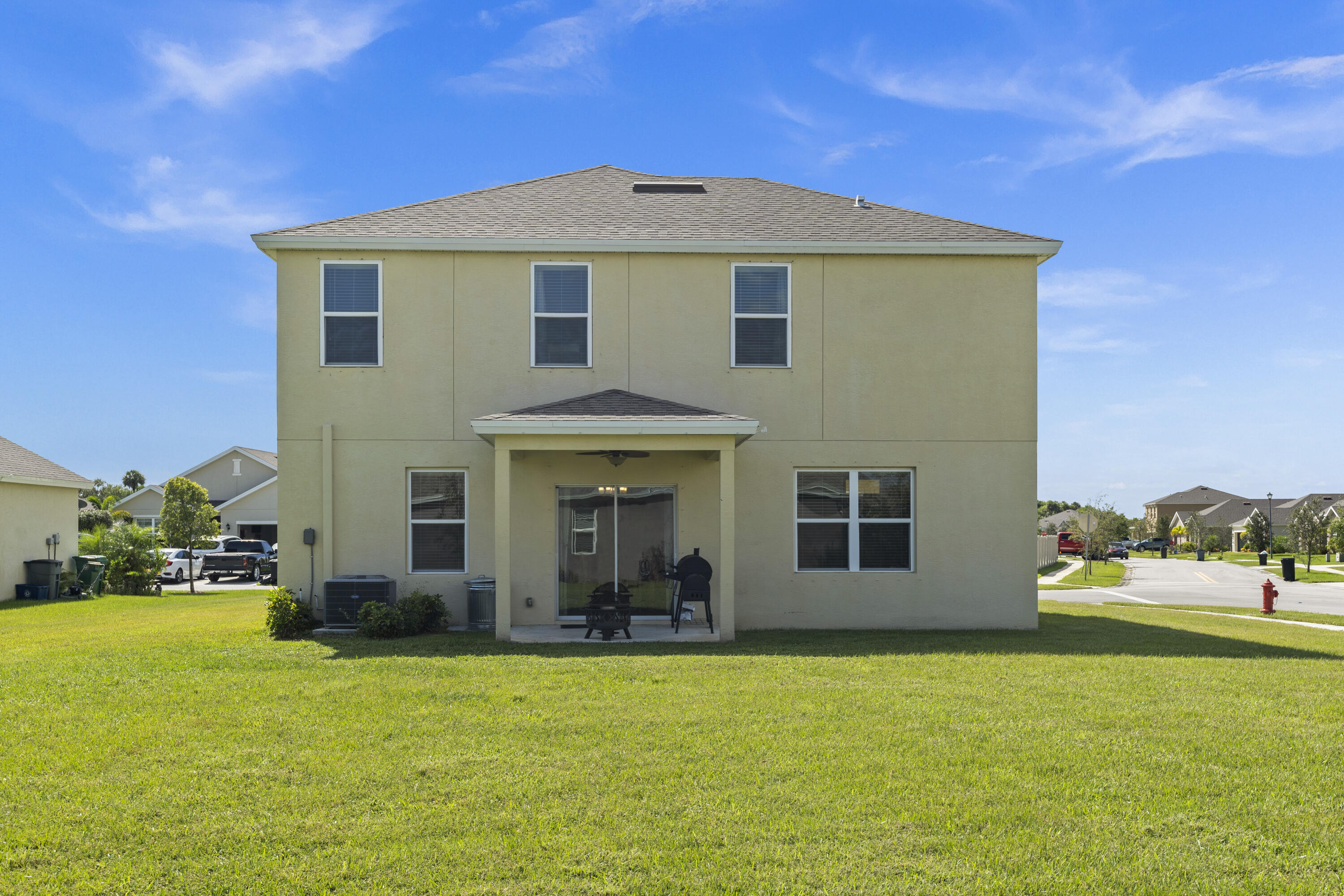 3100 Yellowstone Circle Fort Pierce, FL 34945 - Photo 27 of 28 a front view of a house with a yard