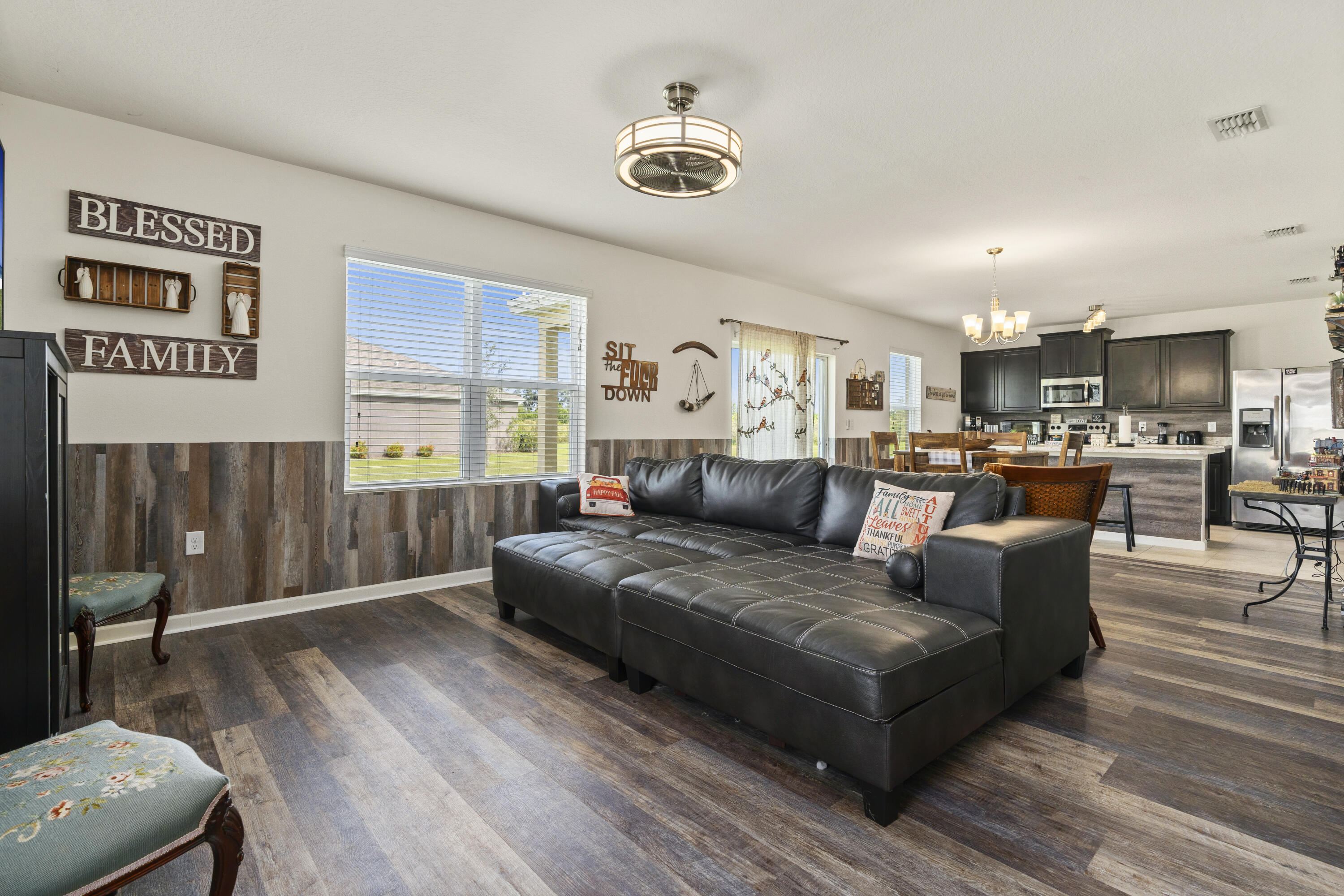 3100 Yellowstone Circle Fort Pierce, FL 34945 - Photo 5 of 28 a living room with furniture and a chandelier